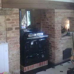 Range cooker installed in a restored brick inglenook